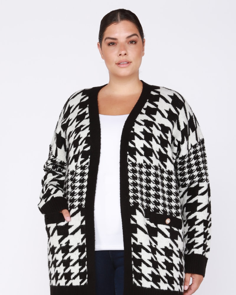 Front of a model wearing a size 0X Rebecca Open Front Houndstooth Cardigan in Black / White by DEX PLUS. | dia_product_style_image_id:237834